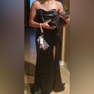 A satin black dress with a slit